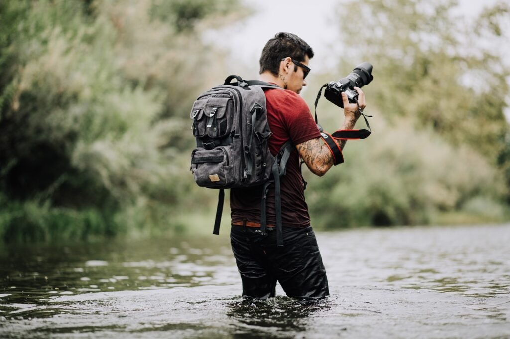 people, man, camera, nature, photographer, travel, adventure, river, bag, green, grass